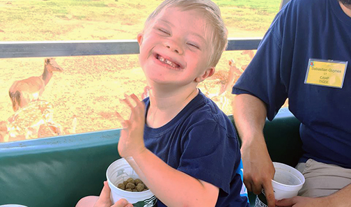 camper feeding animals at Global Wildlife Center